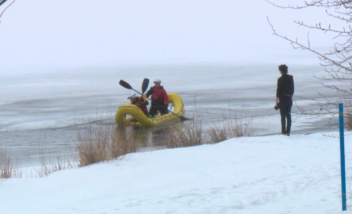 Adrian Antwright looks on as an Edmonton Fire Rescue water rescue crew searches for his dog Clyde. Monday, February 23, 2015.