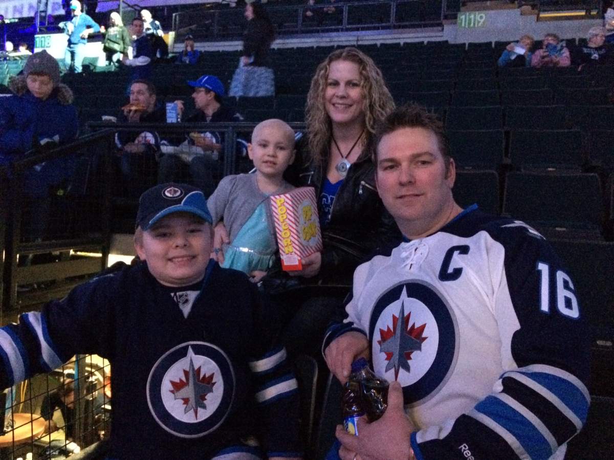 The Delaloye family at the MTS Centre ready for Alyx’s first Winnipeg Jets game.