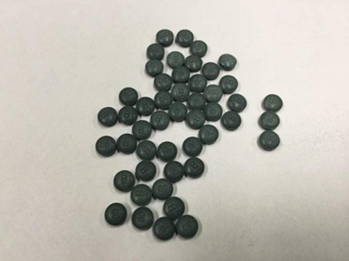 Photo of pills believed to be fake oxycontin found at a residence in Prince Albert, Sask. on Feb. 23, 2015.