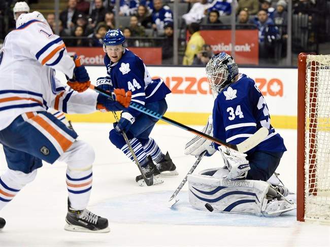 Toronto Maple Leafs goalie James Reimer stops Edmonton Oilers' Nail Yakupov during third period NHL action in Toronto on Saturday, Feb. 7, 2015.