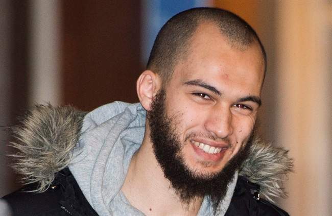 Merouane Ghalmi smiles as he arrives at the Montreal Courthouse in Montreal, Thursday, February 26, 2015.