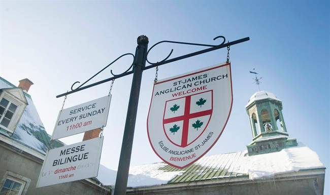 Signs in English and French hang outside St. James Anglican Church in Trois-Rivières, Que., Sunday, January 25, 2015.
