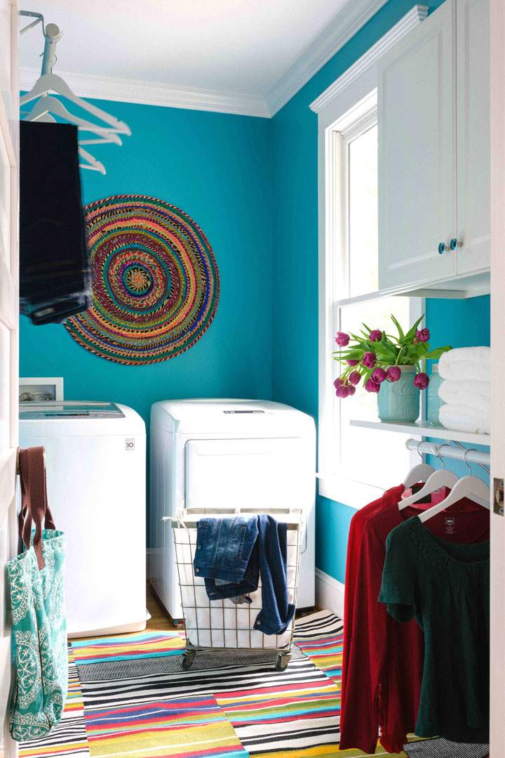 This photo provided by Brian Patrick Flynn and HGTV.com shows This laundry room, designed by Flynn, is covered in a high energy hue which many of his clients ask for, aqua. Flynn suggests using bold color schemes in feminine spaces to make them fun rather than more expected tones such as muted pinks, lilac and coral.