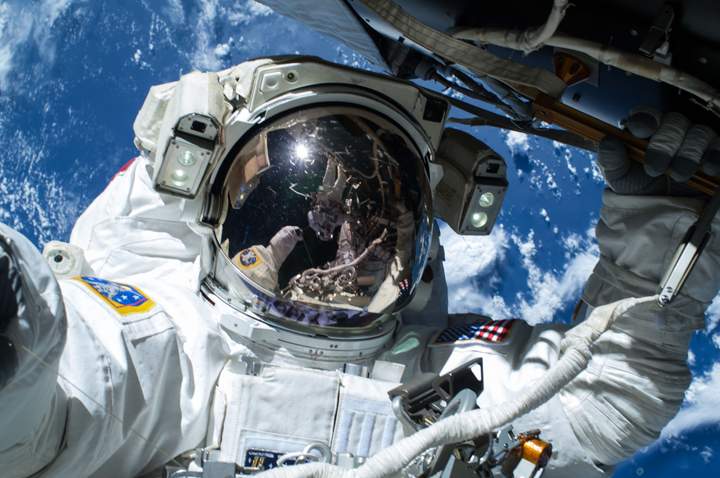 Four astronauts have been selected as the first to fly in the new American crew vehicles being designed by SpaceX and Boeing.