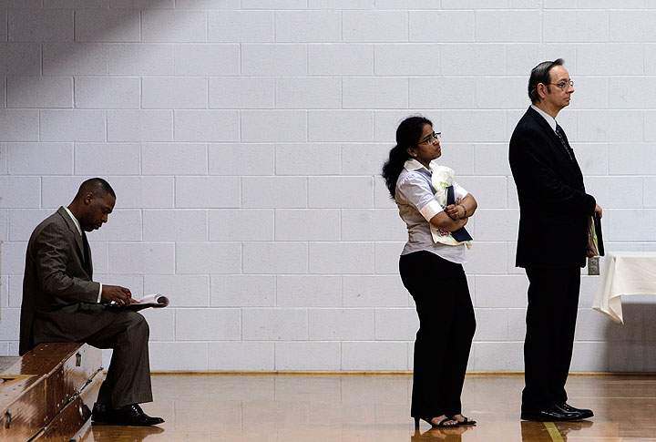In this file photo, job seekers wait in a line at a job fair. An exclusive Ipsos Reid survey for Global News found that nearly half (45 per cent) of Canadians polled said their income, or keeping a steady income, is causing them stress.