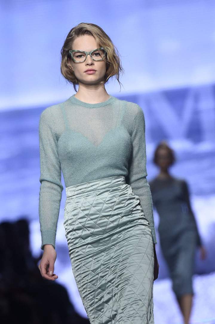 German model Anna Ewers presents a creation for fashion house Max Mara at the women Fall / Winter 2015/16 Milan's Fashion Week on February 26, 2015 in Milan.