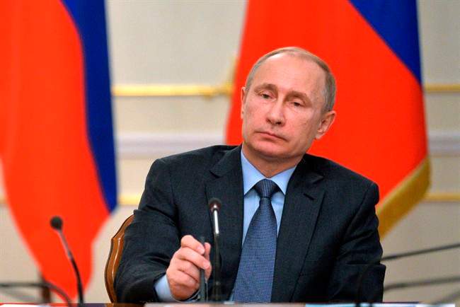 Russian President Vladimir Putin listens during the State Council meeting in the Novo-Ogaryovo residence, outside Moscow, Russia, Tuesday, Feb. 24, 2015. 