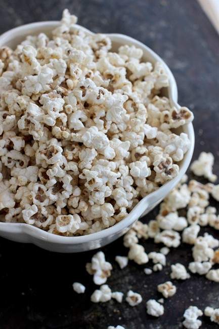 This Jan. 19, 2015 photo shows salty sweet peanut honey popcorn in Concord, N.H. The recipe is simple, with just enough sweetness from a hit of honey to balance the salty peanut flavor. Using coconut oil for the popping rounds out the flavor.