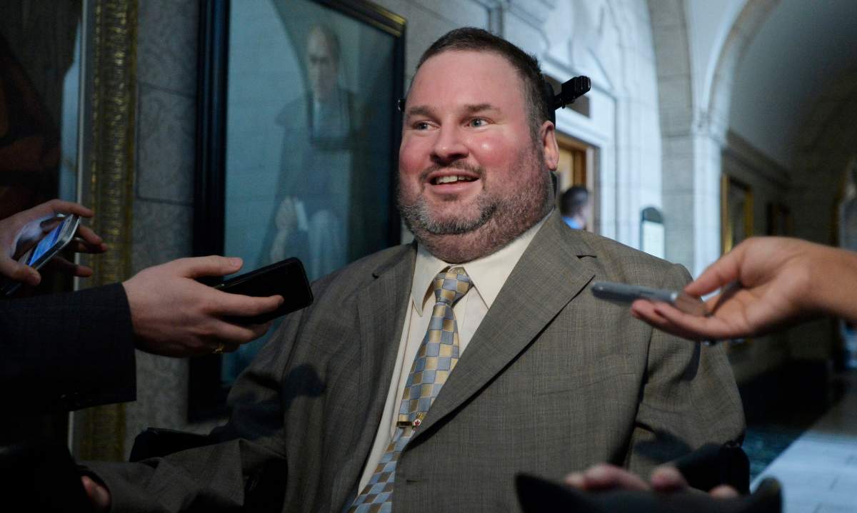 Conservative MP Steven Fletcher scrums with media in Ottawa on Wednesday, February 25, 2015. THE CANADIAN PRESS IMAGES/Matthew Usherwood.