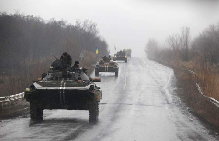 Ukranian military vehicles are seen driving on the road toward the town of Artemivsk, Ukraine on Feb. 1, 2015.