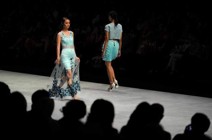 Models showcase designs by Imelda Sparks Fashion Academy on the runway in the Shades of Pastel: New Beginning of Easiness show during Indonesia Fashion Week 2015 at Jakarta Convention Center on February 26, 2015 in Jakarta, Indonesia.