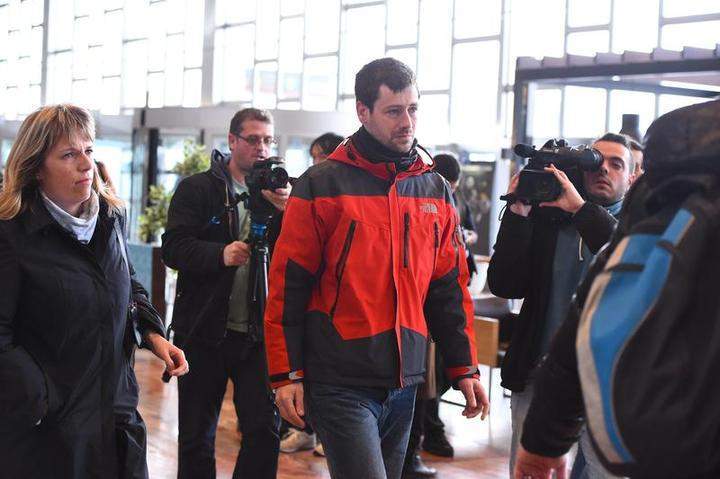 A relative of passengers arrives at the Terminal 2 of the Barcelona El Prat airport in Barcelona, Spain.