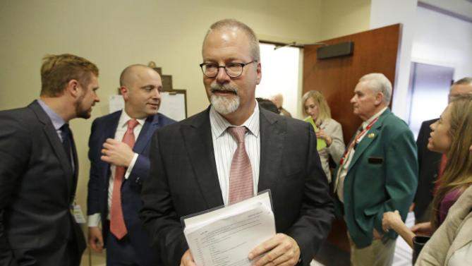 Sen. Stephen Urquhart, R-St. George, leaves a House committee hearing Tuesday, March 10, 2015, in Salt Lake City. An anti-discrimination bill protecting LGBT Utah residents and religious rights awaits a final vote by lawmakers. The bill was approved on Tuesday afternoon. It was originally scheduled for Monday, but postponed by the House Judiciary Committee after an hour-long hearing so that they could hear more comments from the public. (AP Photo/Rick Bowmer).