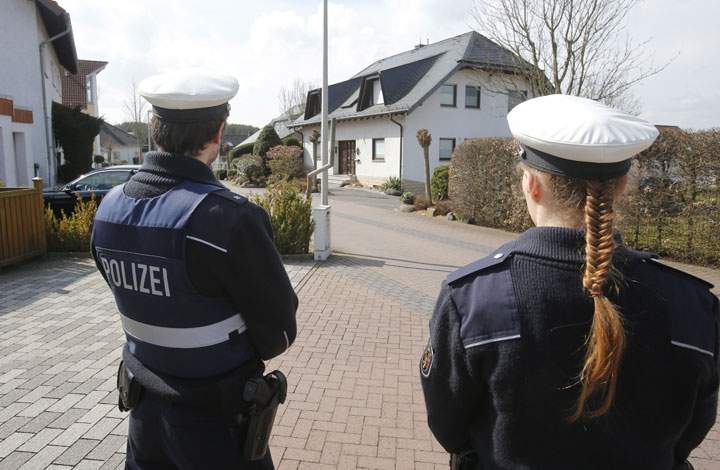 Police hold media away from the house where Andreas Lubitz lived in Montabaur, Germany, Thursday, March 26, 2015. Lubitz was the co-pilot on flight Germanwings 9525 that crashed with 150 people on board on Tuesday in the French Alps.