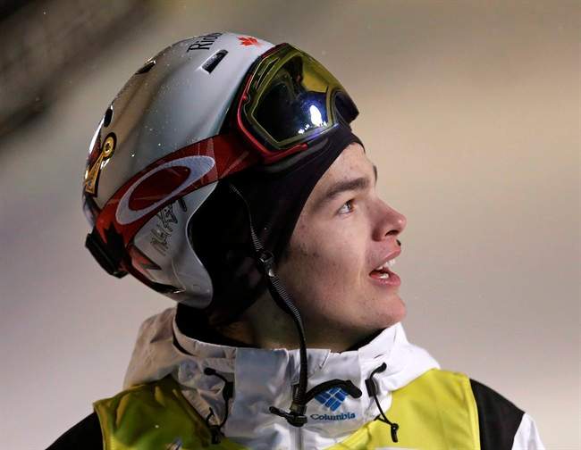 Mikael Kingsbury of Canada waits after his run during the men's freestyle skiing World Cup dual moguls Saturday, Jan. 10, 2015, in Park City, Utah.