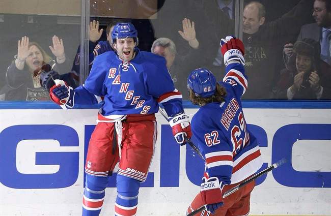 New York Rangers' Lee Stempniak (12) celebrates after scoring a goal against the Arizona Coyotes in New York on Thursday. The Winnipeg Jets made another move for their playoff run by acquiring winger Lee Stempniak from the New York Rangers for young forward Carl Klingberg on Sunday.
