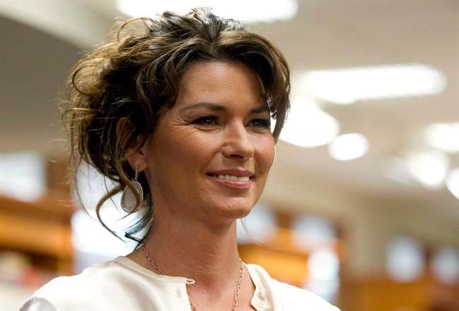Shania Twain arrives to sign copies of her new book "From This Moment On" in Toronto Monday, May 9, 2011.