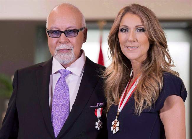 Canadian music star Celine Dion and husband Rene Angelil pose for photos after being decorated with the Order of Canada in Quebec City on July 26, 2013.