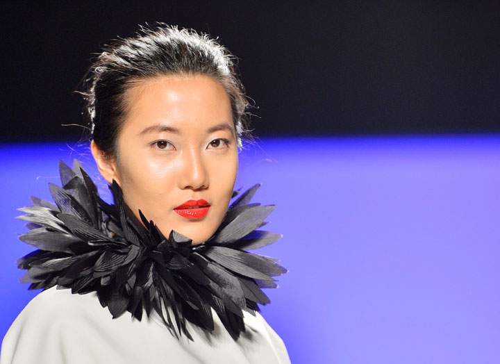 A model shows a creation by David Dixon while walking the runway during Toronto Fashion Week in Toronto on Tuesday, March 19, 2013.