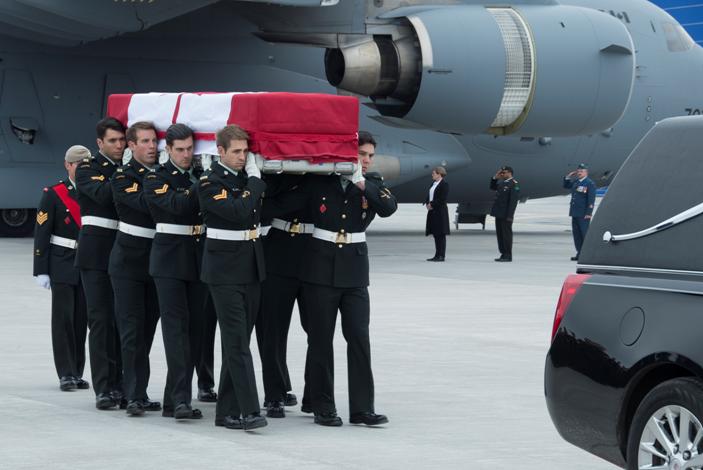 Military pallbearers from the Canadian Special Operations Forces Command carry the flag-draped casket of Sgt. Andrew Joseph Doiron.