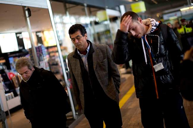 A family of people involved in a crashed plane arrives at the Barcelona airport in Spain