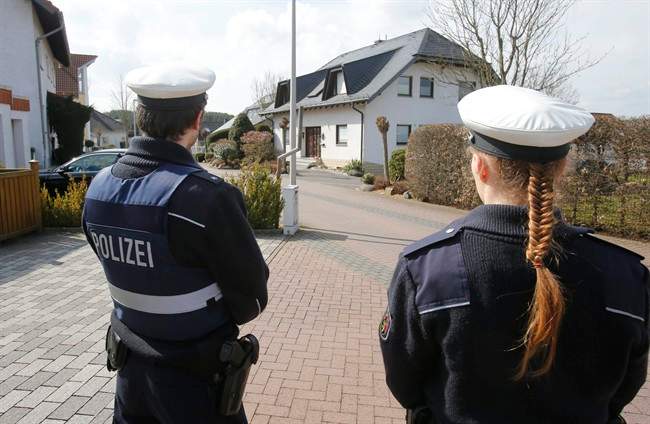 Police stand guard outside the house where Andreas Lubitz is believed to have lived in Montabaur, Germany, on Thursday, Mar. 26, 2015.