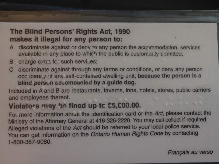 The back of Diane Bergeron's card explaining that police are supposed to investigate when she is denied service.