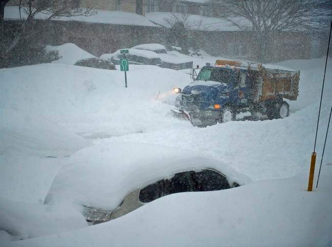A snowplow clears a residential street in Dartmouth, N.S. on Wednesday, March 18, 2015.