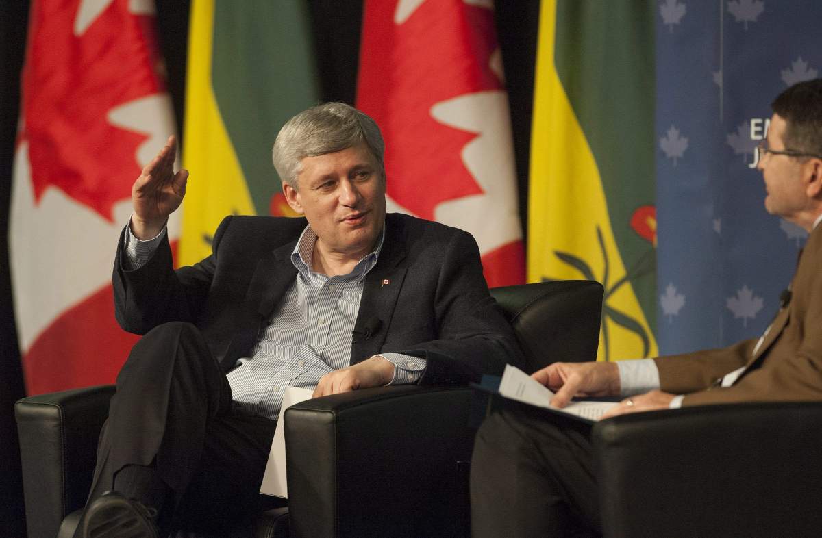 Prime Minister Stephen Harper, left, participates in a moderated question and answer session with SARM President Ray Orb at the Saskatchewan Association of Rural Municipalities annual convention in Saskatoon on Thursday, March 12, 2015.