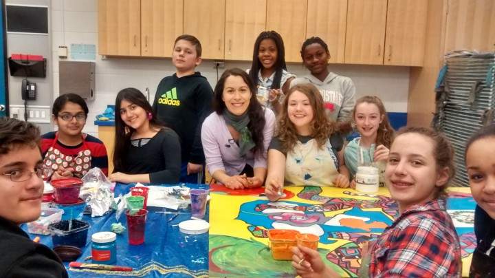 Joseph Brant students painting murals with Arts Educator Sandra Tarantino.