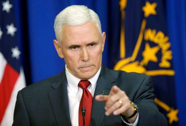 Indiana Gov. Mike Pence takes a question during a news conference, Tuesday, March 31, 2015, in Indianapolis. Pence said that he wants legislation on his desk by the end of the week to clarify that the state's new religious-freedom law does not allow discrimination against gays and lesbians.
