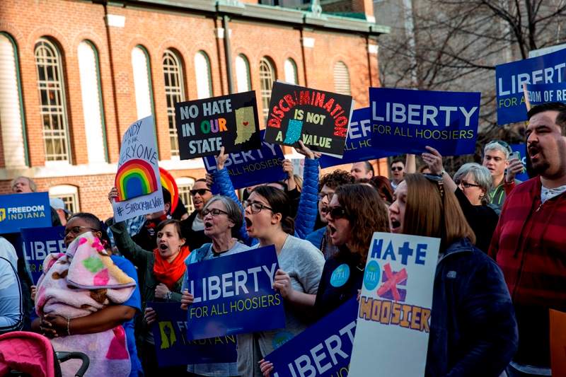 Demonstrators gather outside the City County Building on March 30, 2015 in Indianapolis, Indiana. The group called on the state house to roll back the controversial Religious Freedom Restoration Act, which critics say can be used to discriminate against gays and lesbians.