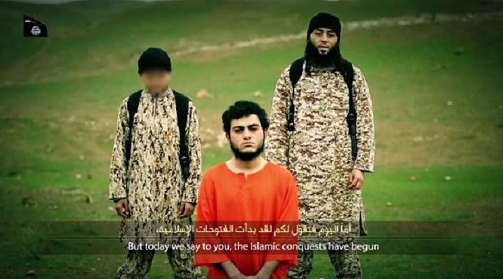 This child appears to execute a man who admits spying for the Mossad in a new video released by ISIS.