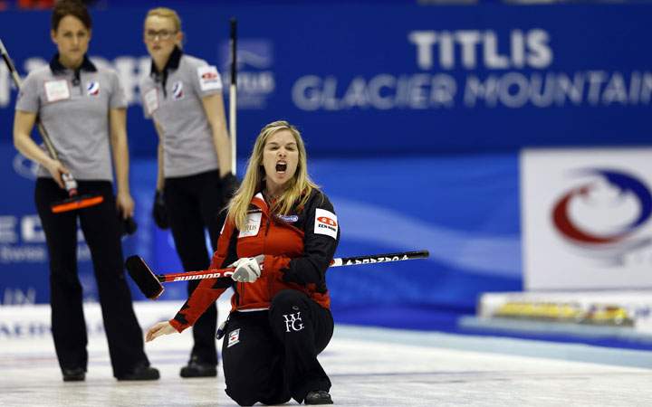 Canada's skip Jennifer Jones, front, yells as the team plays Russia during the fourth end of their semifinal match at the women's World Curling Championships in Sapporo, Japan, Saturday, March 21, 2015.