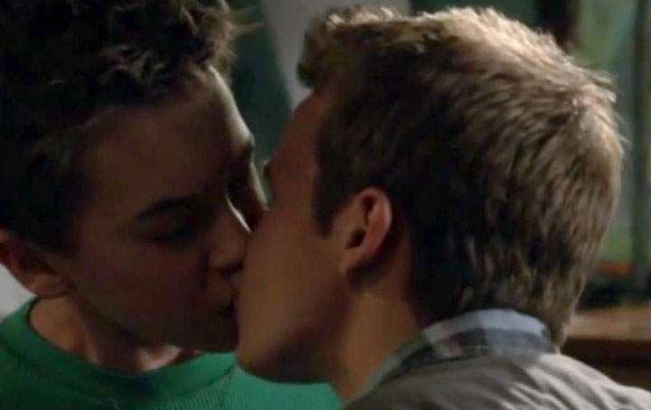 Hayden Byerly, left, and Gavin MacIntosh kiss in a scene from 'The Fosters.'.