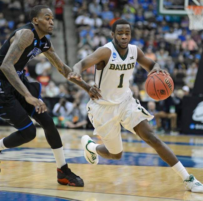 Baylor\’s Kenny Chery (1) drives around Georgia State\’s Kevin Ware, left, during the first half in the second round of the NCAA college basketball tournament, Thursday, March 19, 2015, in Jacksonville, Fla.