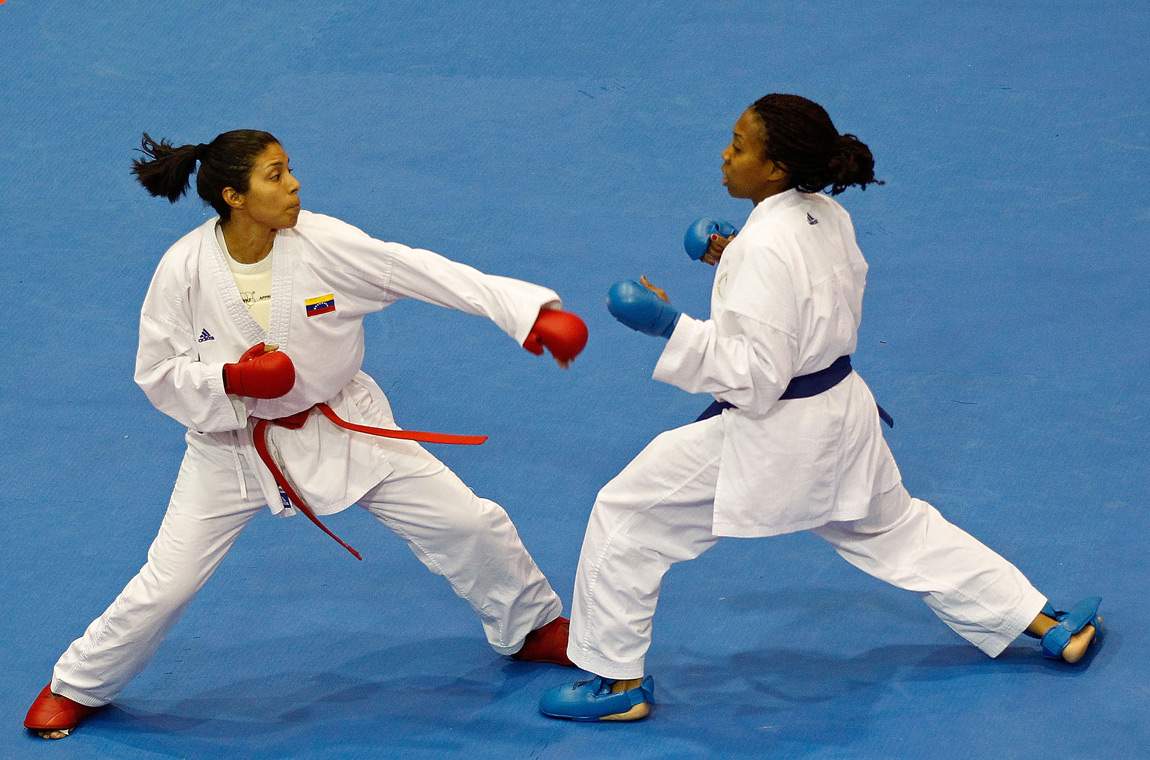 Cheryl Murphy of the USA (Blue) fights Yoly Guillen of Venezuela during a Karate match during Day 14 of the XVI Pan American Games at the San Rafael Parks Sports Complex on October 28, 2011 in Guadalajara, Mexico.