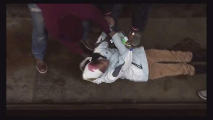 A still from a video shot at Montreal’s Jarry metro station that shows three men saving a woman who was on the tracks is going viral after it was posted on social media.