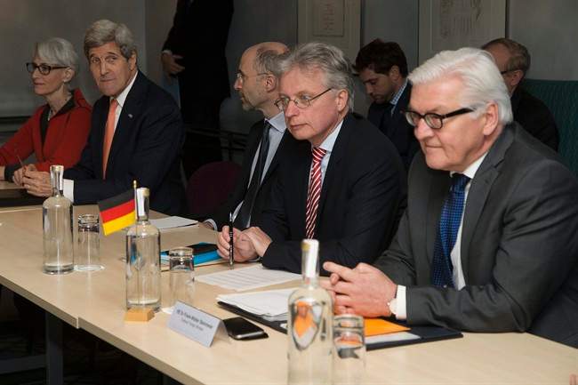 U.S. Secretary of State John Kerry (2nd left) and German Foreign Minister Frank Walter Steinmeier (Right) attend a meeting about the recently concluded round of negotiations with Iran over Iran's nuclear program, in London, England, Saturday, March 21, 2015.
