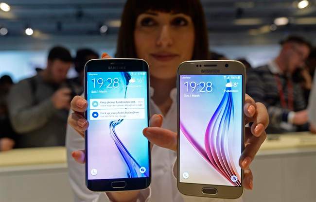 The new Galaxy S6, right, and S6 Edge are displayed during a Samsung Galaxy Unpacked 2015 event on the eve of this week’s Mobile World Congress wireless show in Barcelona, Spain, Sunday, March 1, 2015, unveiling a new phone that ditches its signature plastic design for metal and glass. The South Korean phone manufacturer also unveiled a premium model with a display that curves around the edges.