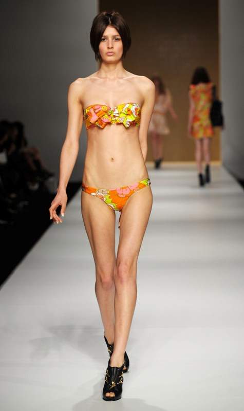 A model showcases an outift by designer Zimmermann on the catwalk during the second day of the Rosemount Australian Fashion Week in Sydney, Australia.