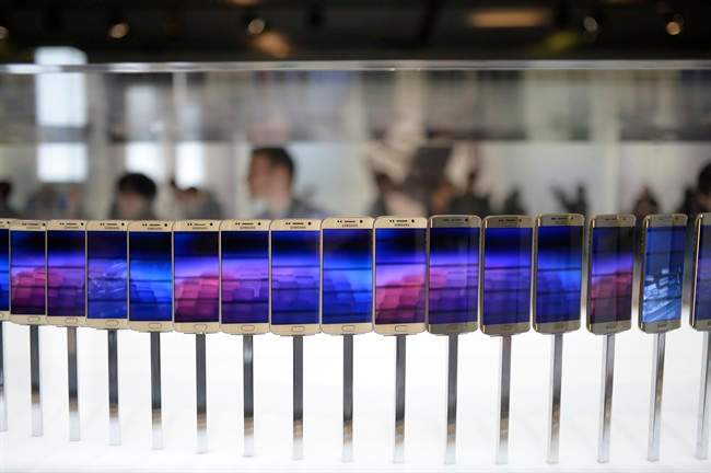  In this March 1, 2015 file photo, the new Galaxy S6 and S6 Edge phones are displayed during a Samsung Galaxy Unpacked 2015 event.