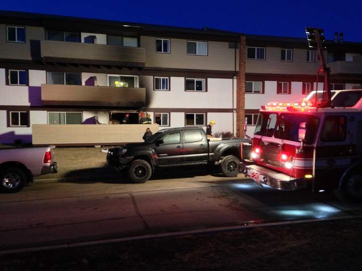 An early morning fire on the ground floor of a three-storey building chased residents into the cold at about 5:30 a.m. Tuesday.