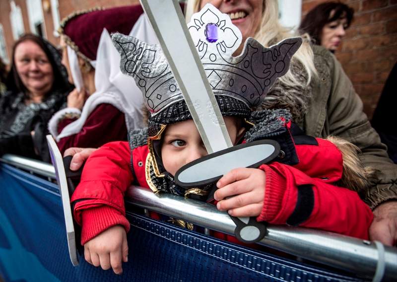Four year old Torin Weston from Leicester, dressed as Richard III waits with his grandmother outside Leicester Cathedral for the reinterment ceremony of King Richard III, on March 26, 2015 in Leicester, England. The skeleton of King Richard III was discovered in 2012 benaeth a car park, in the foundations of Greyfriars Church in Leicester, 500 years after he was killed in the Battle of Bosworth Field.
