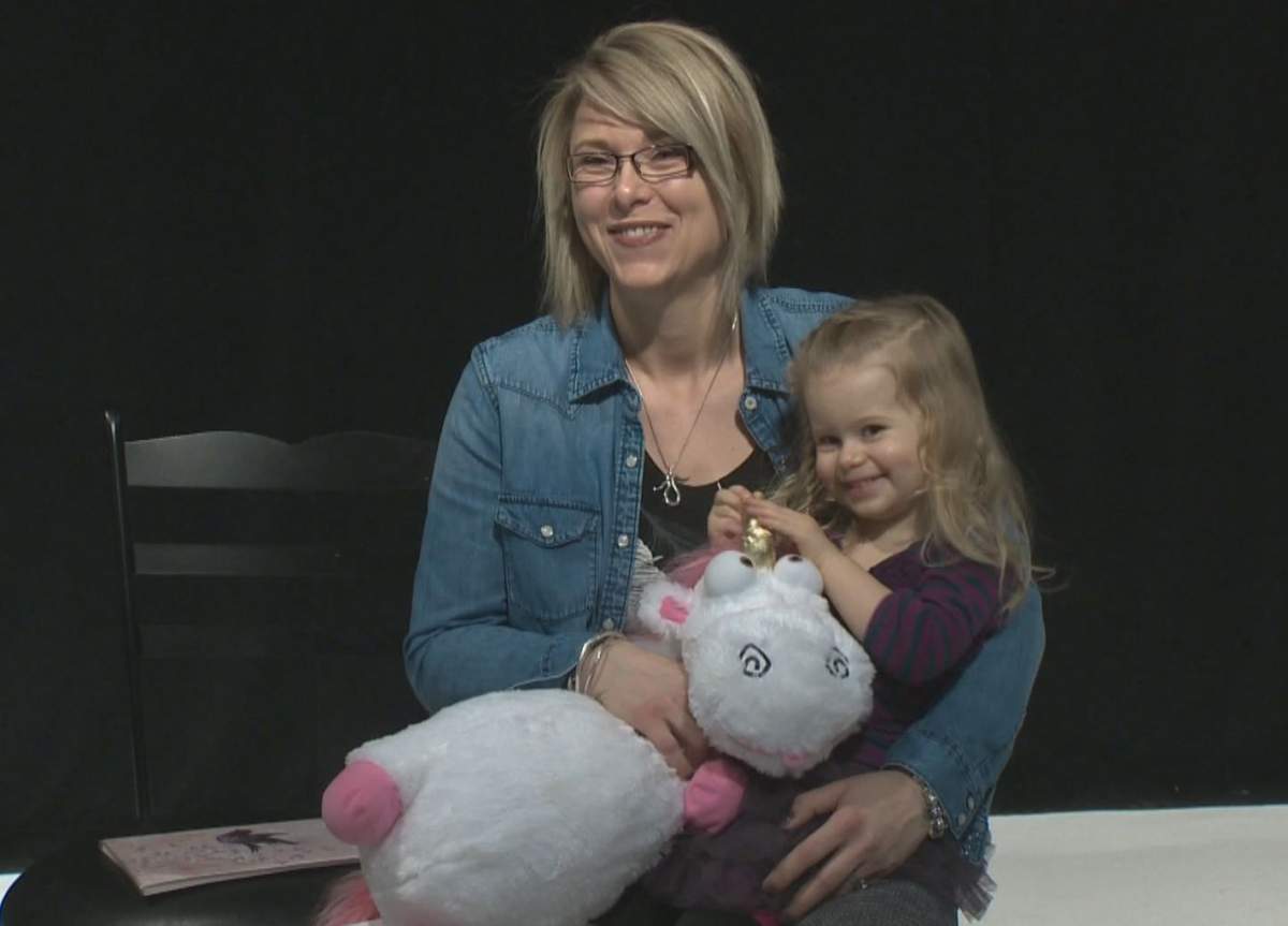 Courteney Stang, daughter Ave and her stuffed unicorn toy.