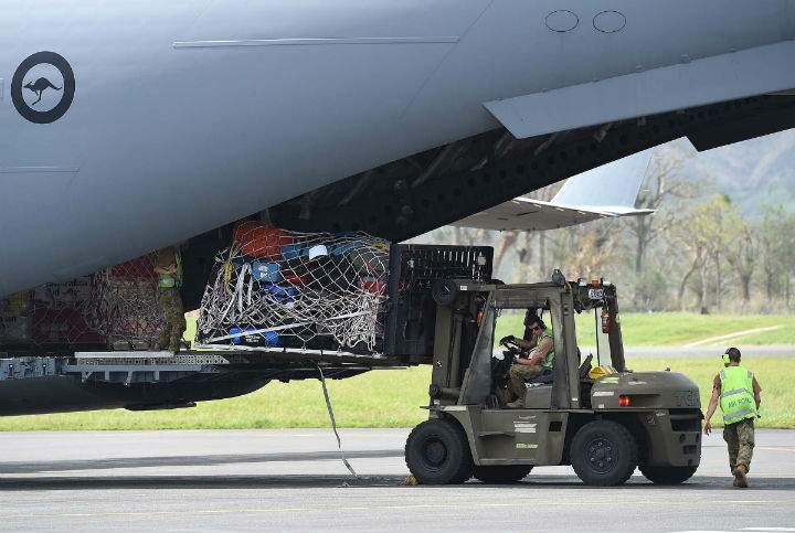 An Australian RAAF C-17 Globemaster containing aid is unloaded on March 16, 2015 in Port Vila, Vanuatu. Cyclone Pam has hit South Pacific islands on Saturday with hurricane force winds, huge ocean swells and flash flooding and has caused severe damage to housing. Aid agencies say it could be one of the worst disasters ever to hit the region.