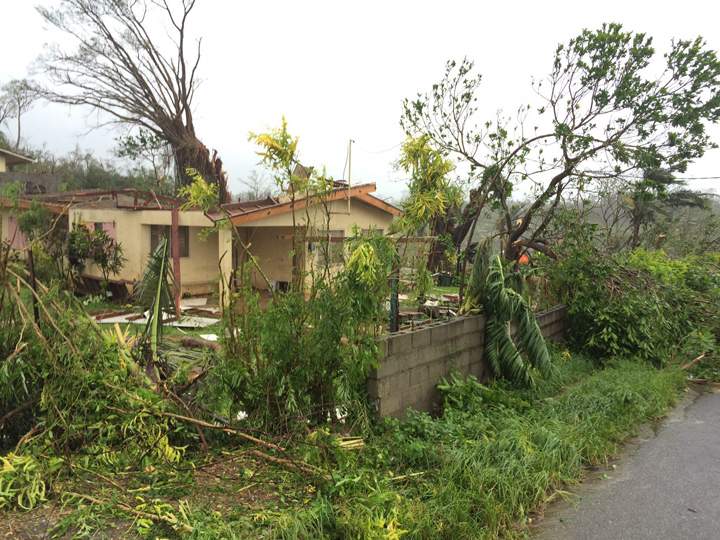 A house is severely damaged in Vanuatu’s capital Port Vila on March 16, 2015 after category five Cyclone Pam on March 13 left infrastructure damaged and the island strewn with debris.