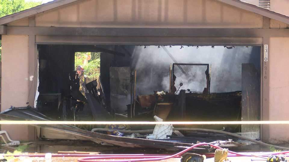 Footage shows firefighter fall through burning roof