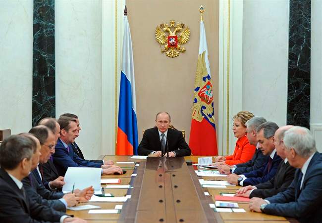 Russian President Vladimir Putin last month praised police and prosecutors for their efforts to battle corruption.  (AP Photo/RIA-Novosti, Mikhail Klimentyev, Presidential Press Service).
