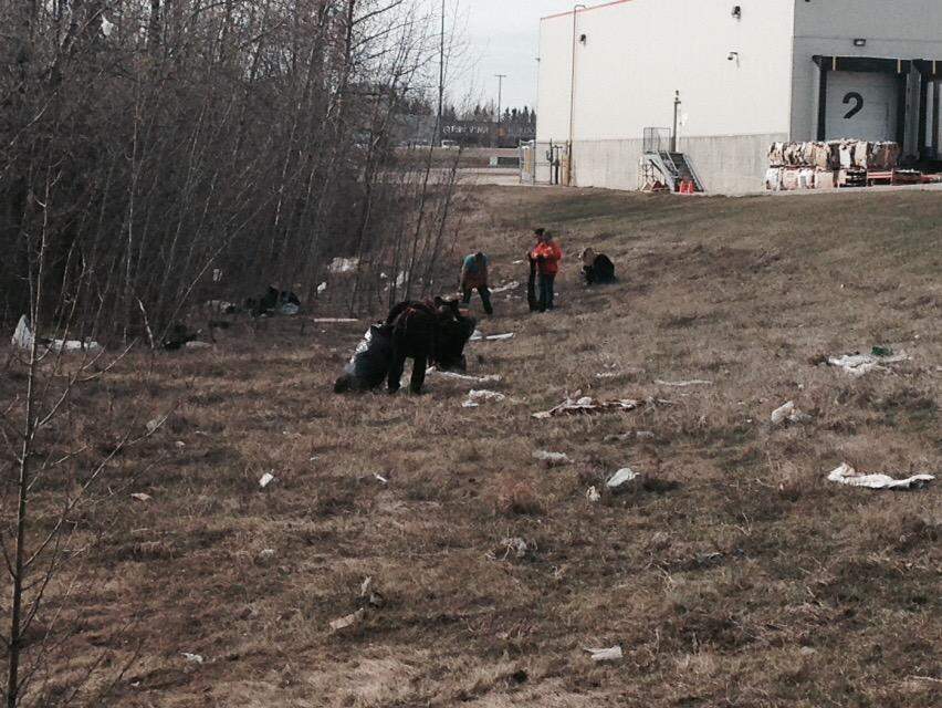 Home Depot crew cleaning up the mess next to the store, April 16, 2015.